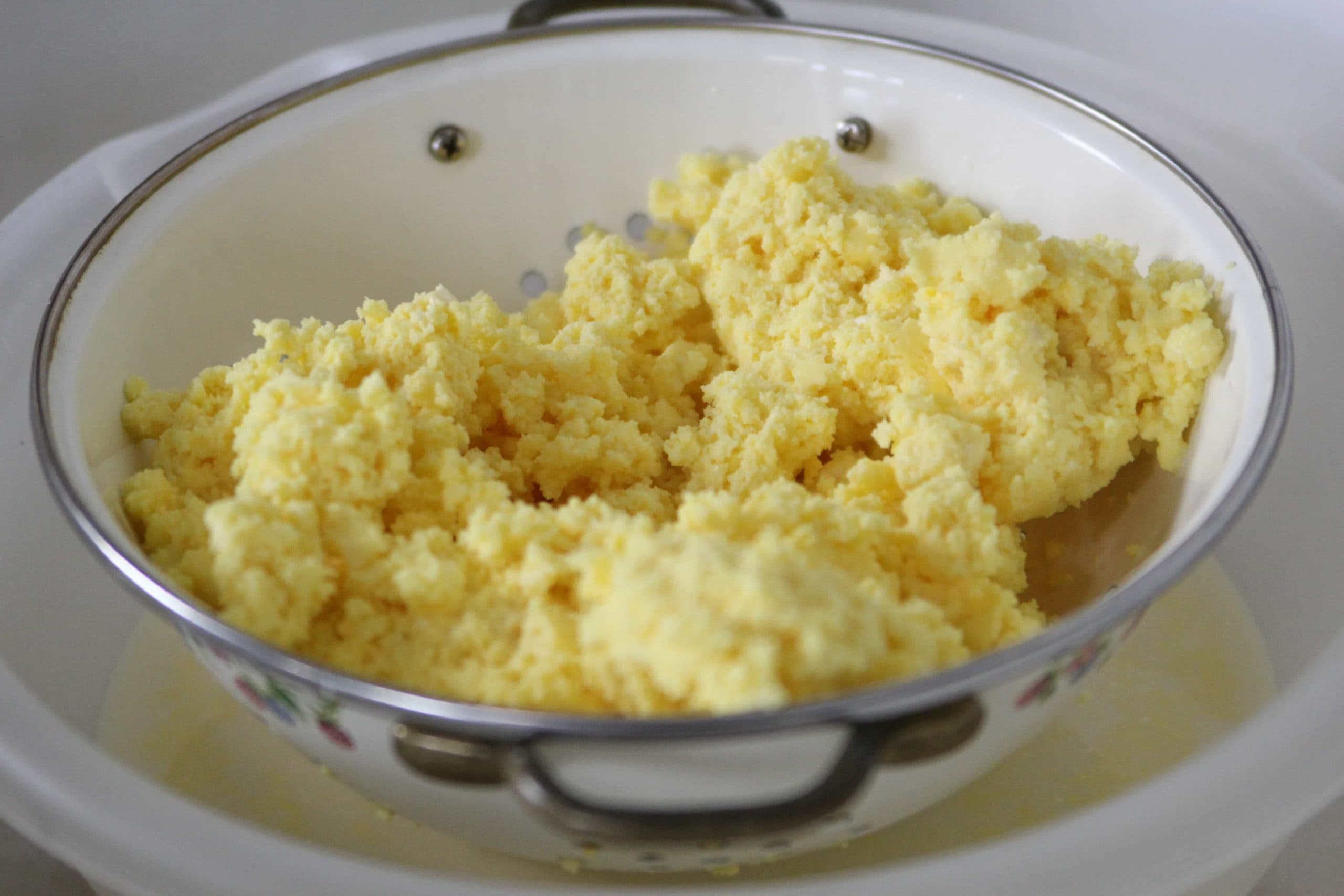 homemade butter in the colander